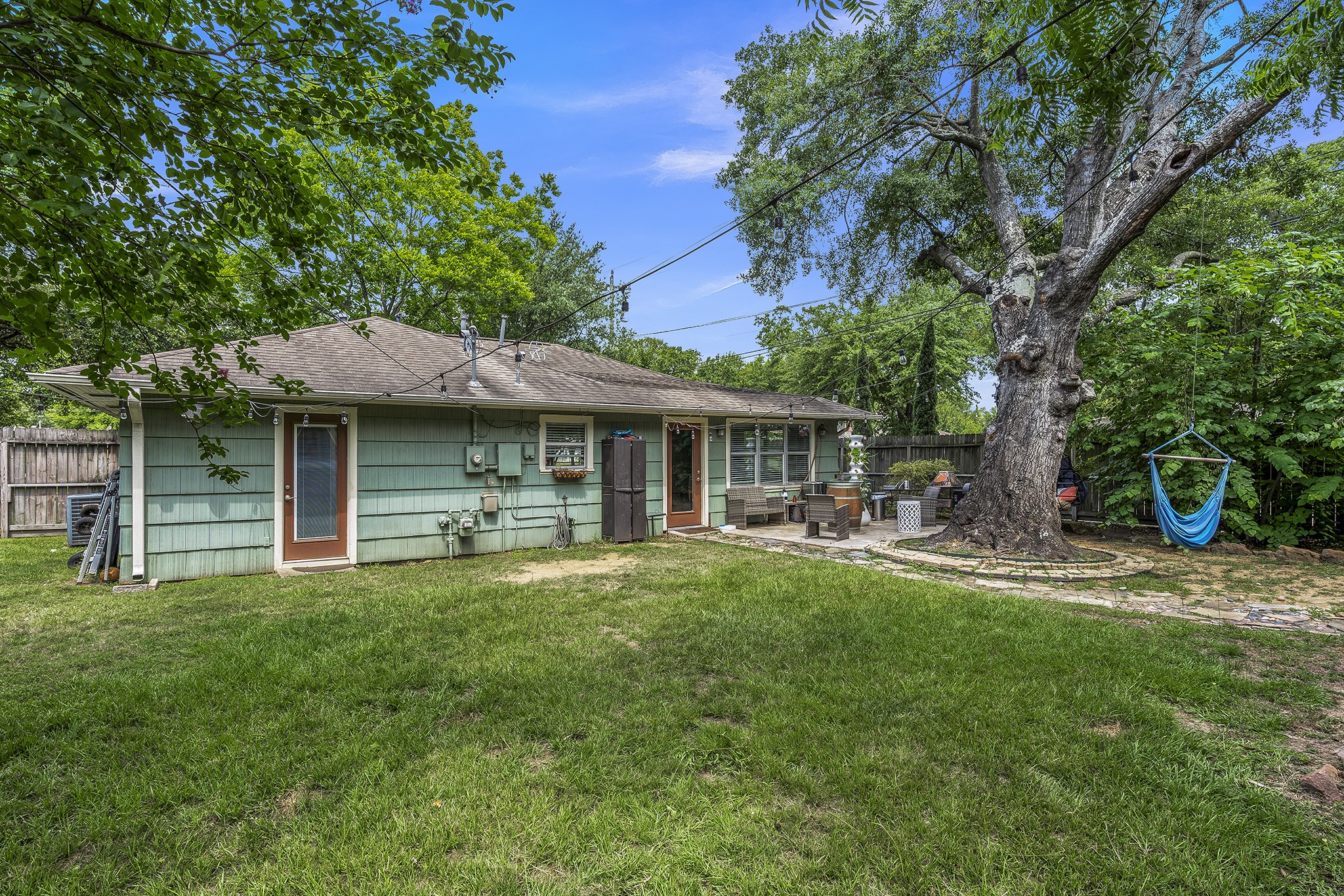 1034 Nashua Street Houston, TX 77008 - Photo 16 of 19 a front view of a house with a garden and trees