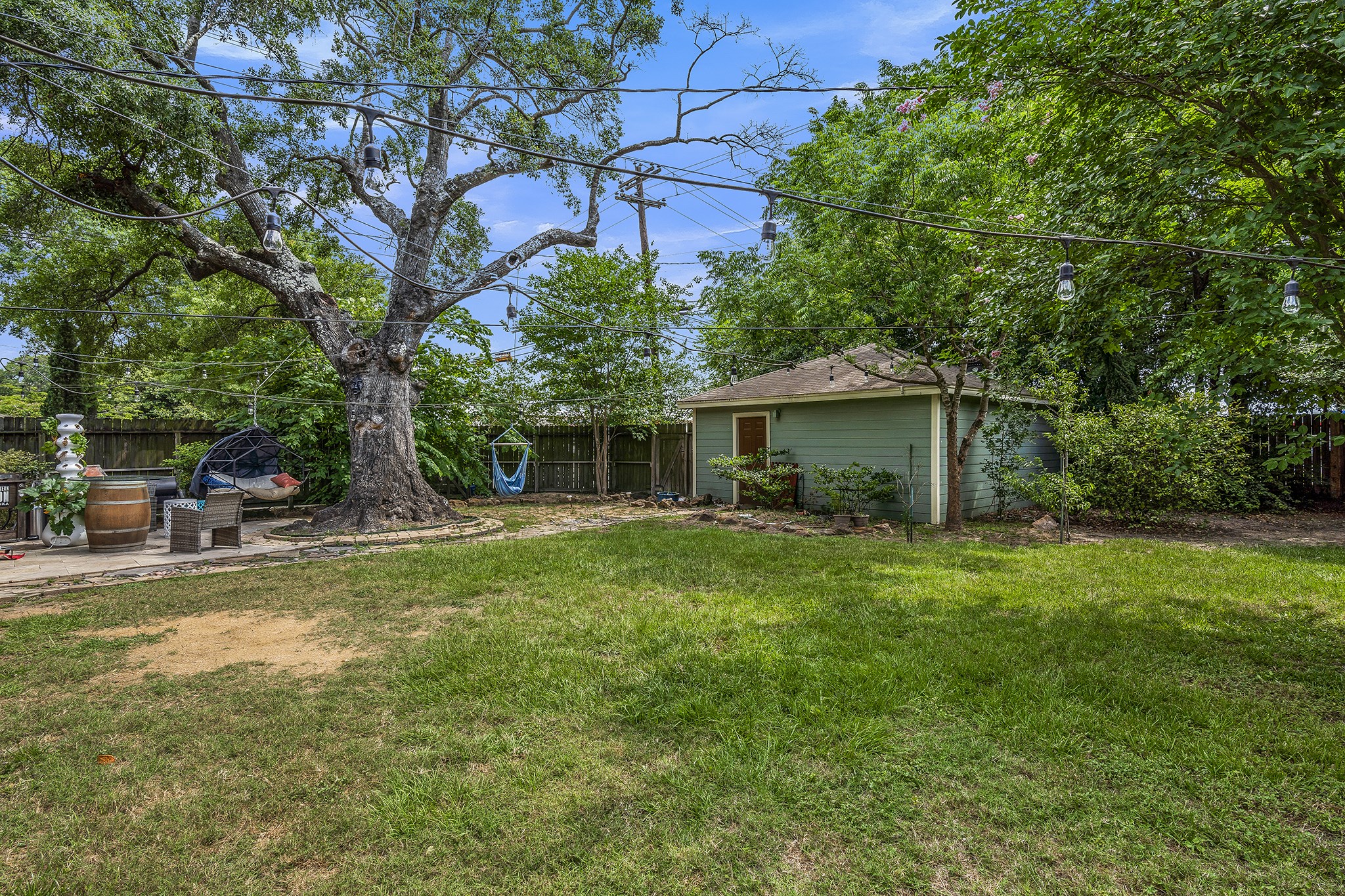 1034 Nashua Street Houston, TX 77008 - Photo 19 of 19 a view of a house with a backyard and a tree