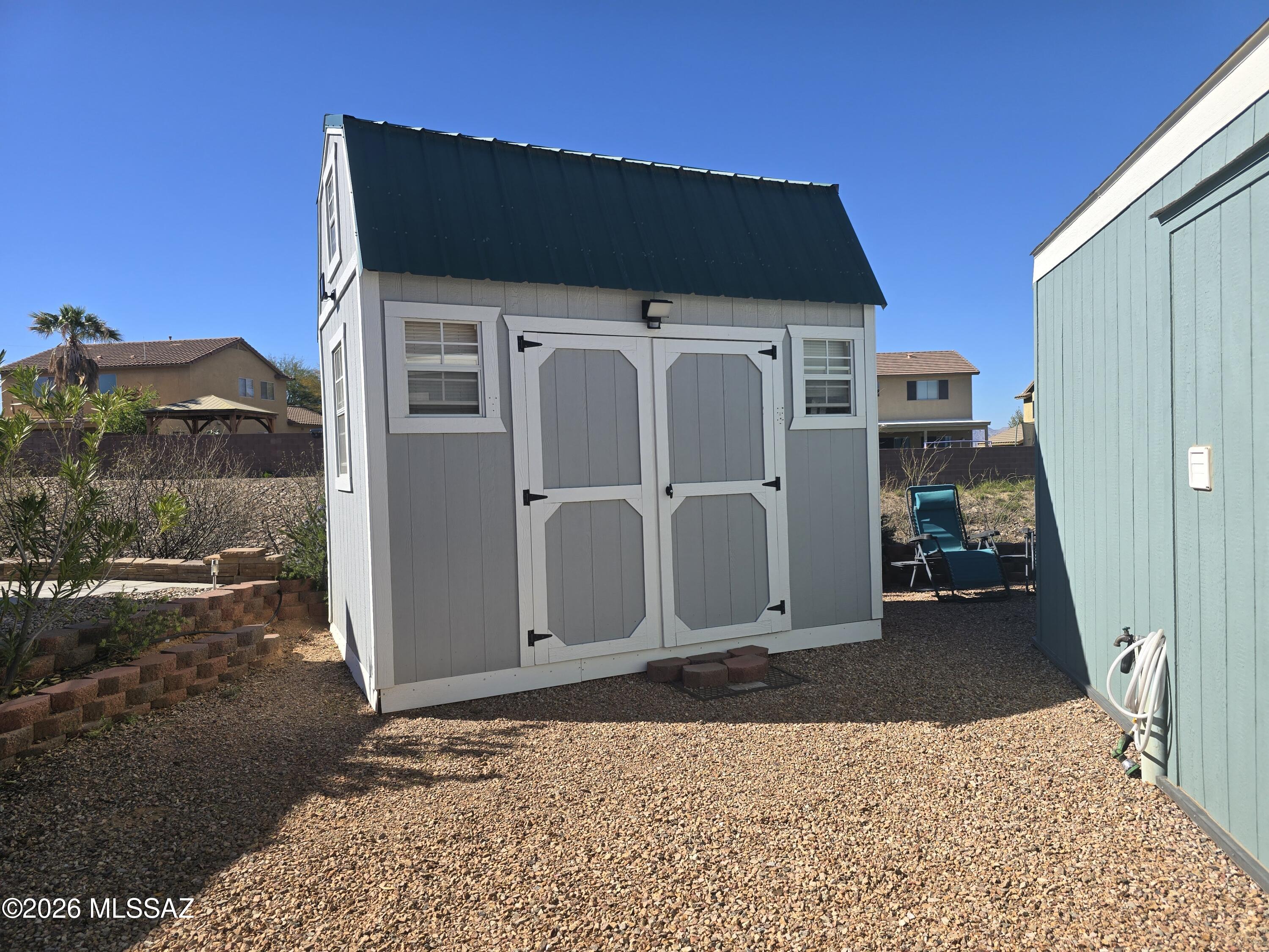 1030 Barrel Cactus Ridge, Unit 230 Benson, AZ 85602 - Photo 3 of 12 a black car parked in front of a building