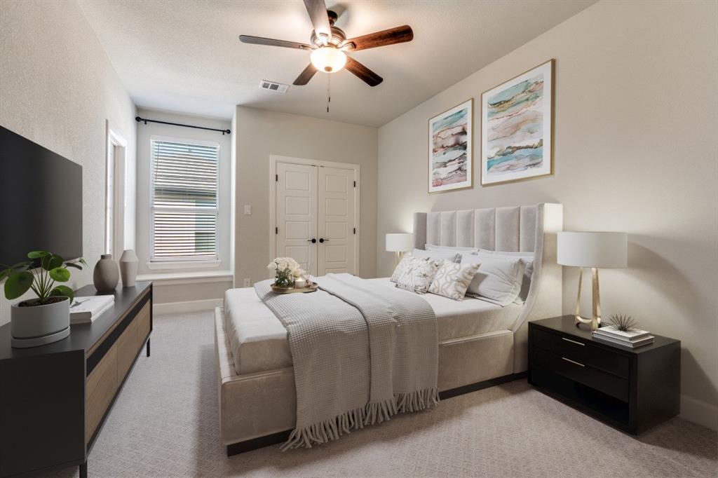 8202 Laflin Lane Dallas, TX 75231 - Photo 16 of 22 a bedroom with bed couch and window