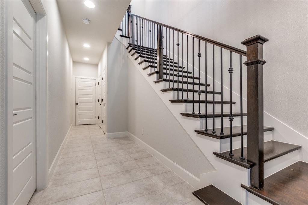 8202 Laflin Lane Dallas, TX 75231 - Photo 3 of 22 a view of entryway with wooden floor and stairs
