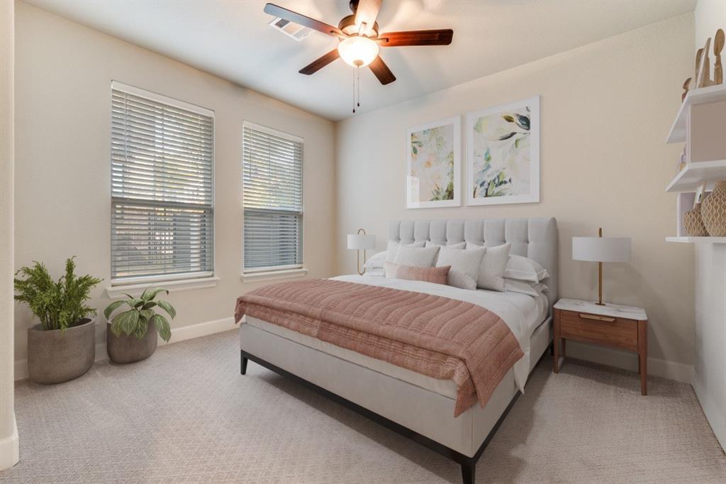 8202 Laflin Lane Dallas, TX 75231 - Photo 5 of 22 a spacious bedroom with a bed and a chandelier