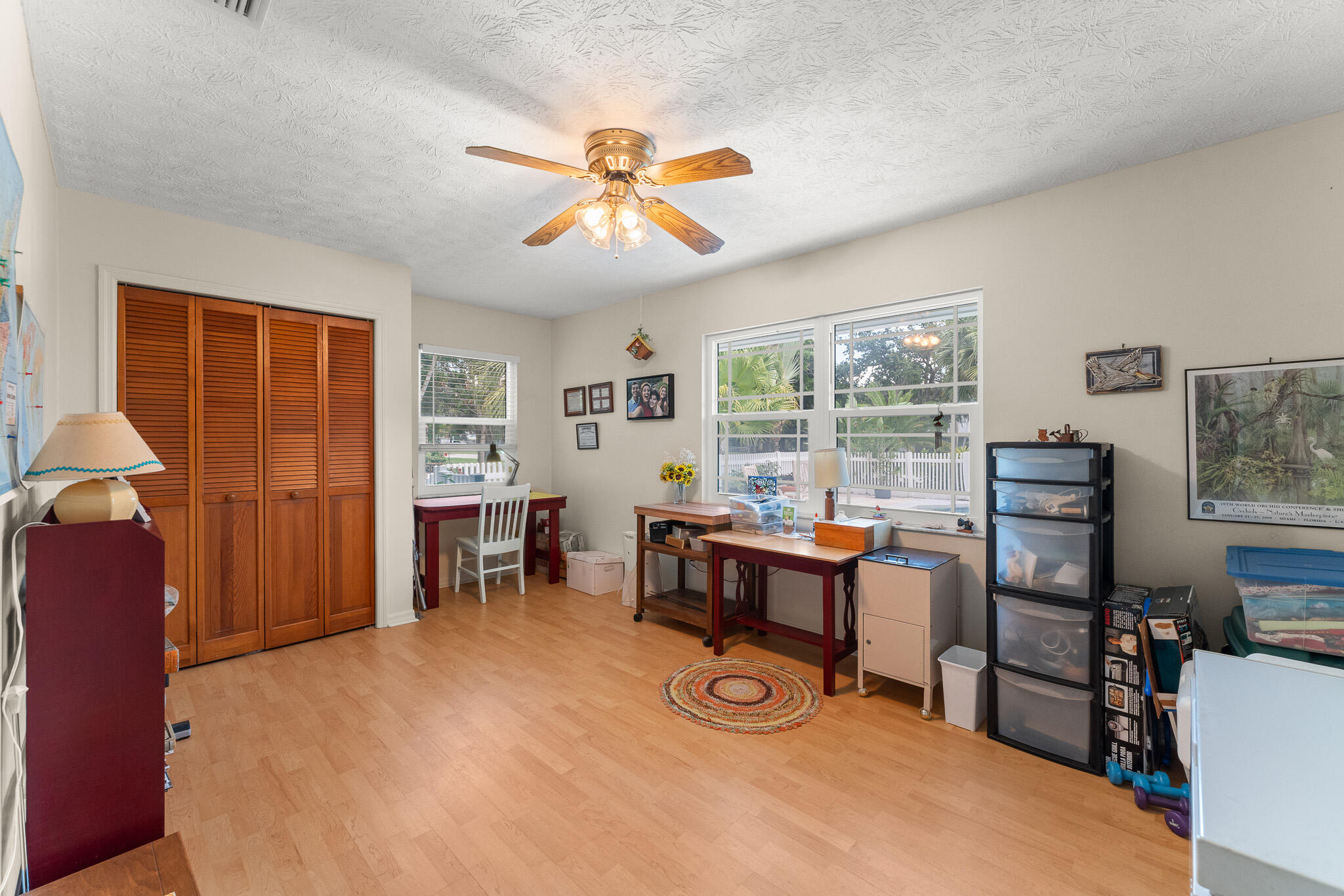 1653 Southwest 85th Terrace Stuart, FL 34997 - Photo 36 of 54 a view of a workspace with furniture and a window