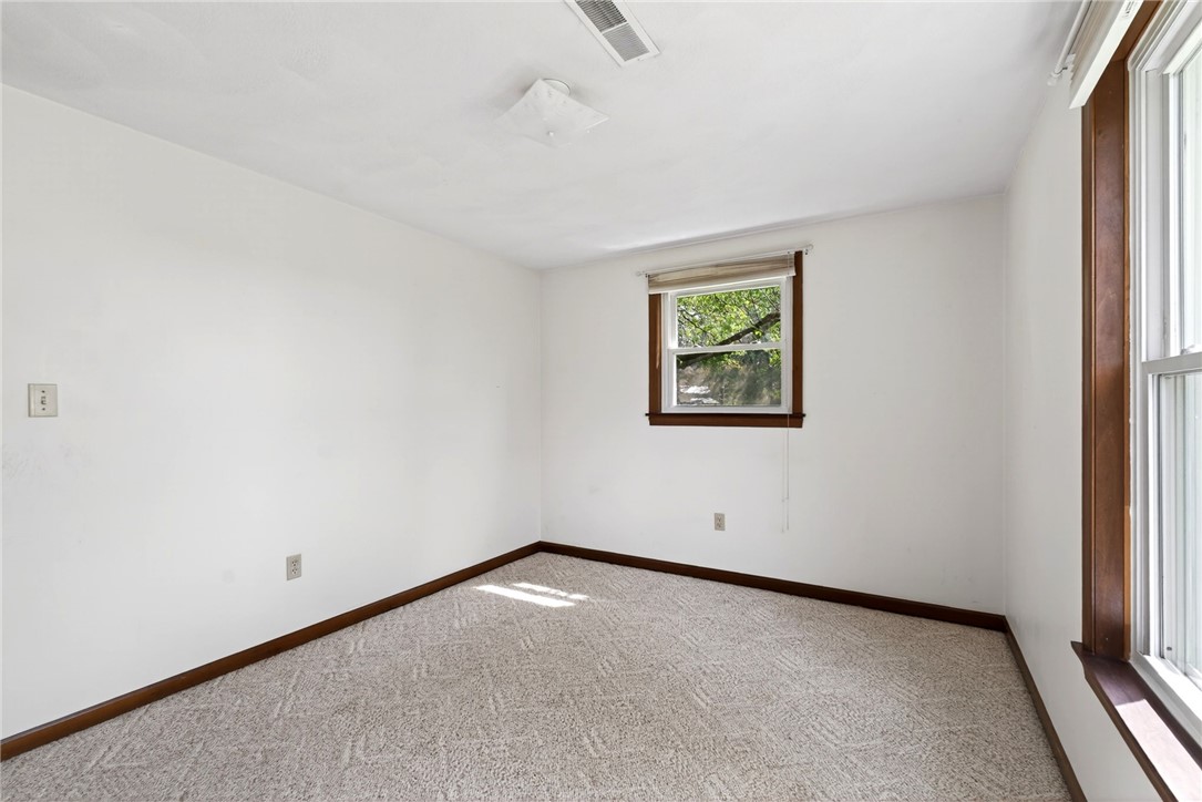 7988 McCool Road Greenville, OH 45331 - Photo 19 of 50 This bright and airy room offers carpet flooring and ample natural light through its windows.