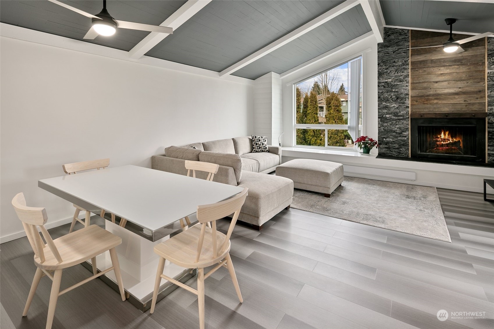7579 Old Redmond Road, Unit 15 Redmond, WA 98052 - Photo 5 of 28 a dinning area with furniture and a fireplace