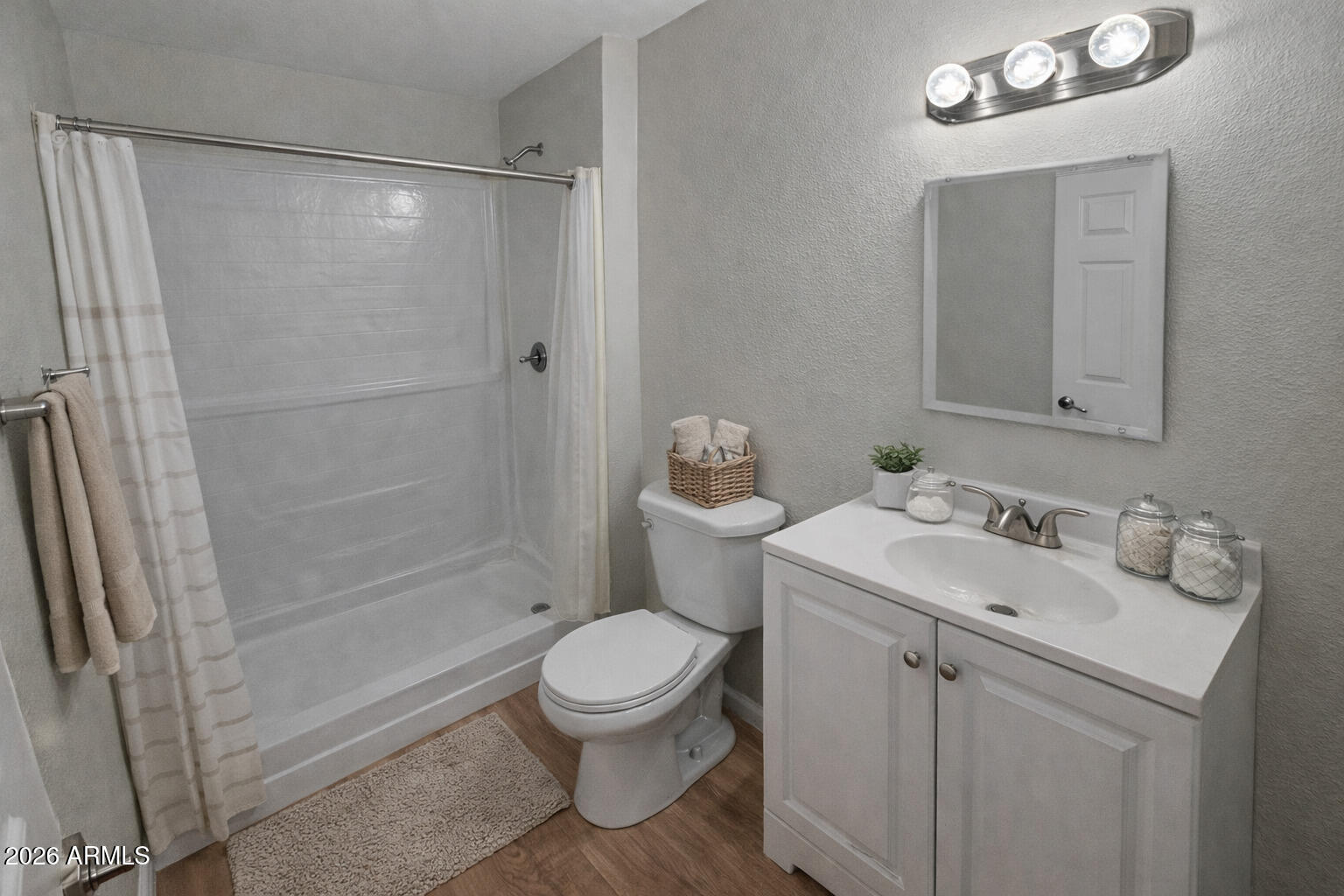 6011 West Nancy Road Glendale, AZ 85306 - Photo 7 of 11 a bathroom with a sink a toilet and shower