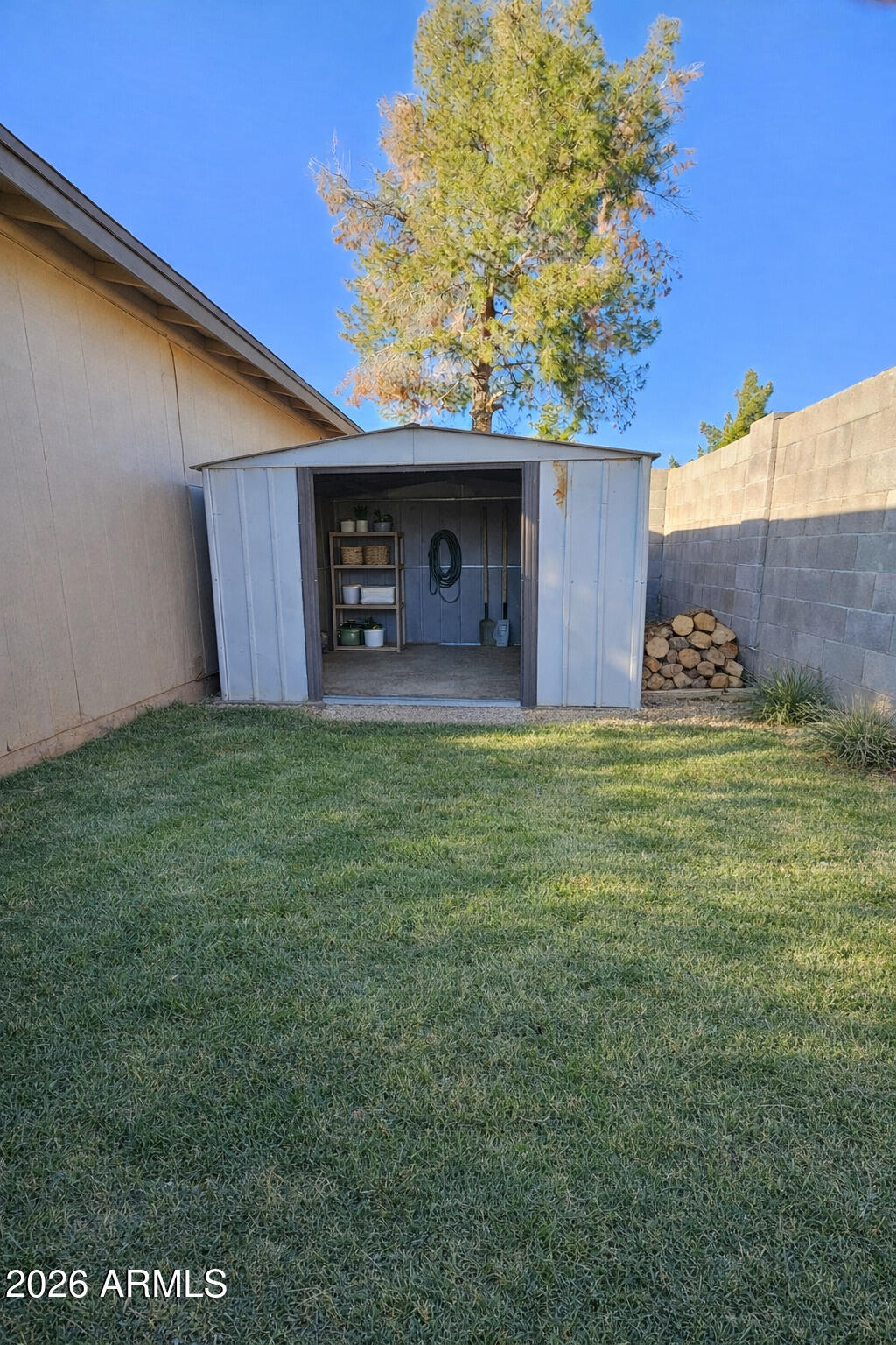6011 West Nancy Road Glendale, AZ 85306 - Photo 10 of 11 a view of a yard with an outdoor space