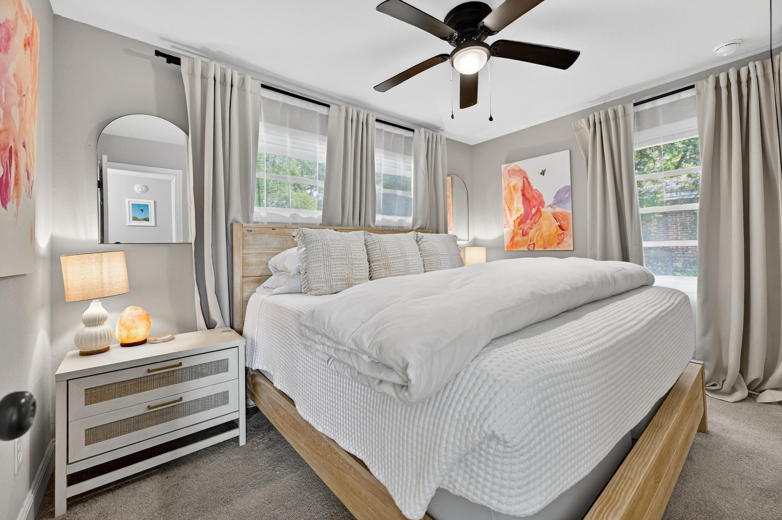 370 Edge Avenue Valparaiso, FL 32580 - Photo 12 of 58 a bedroom with a bed and a chandelier