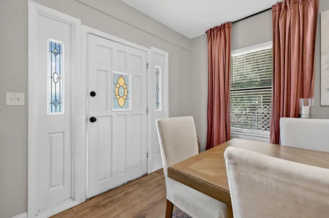 a living room with furniture a ceiling fan and a rug