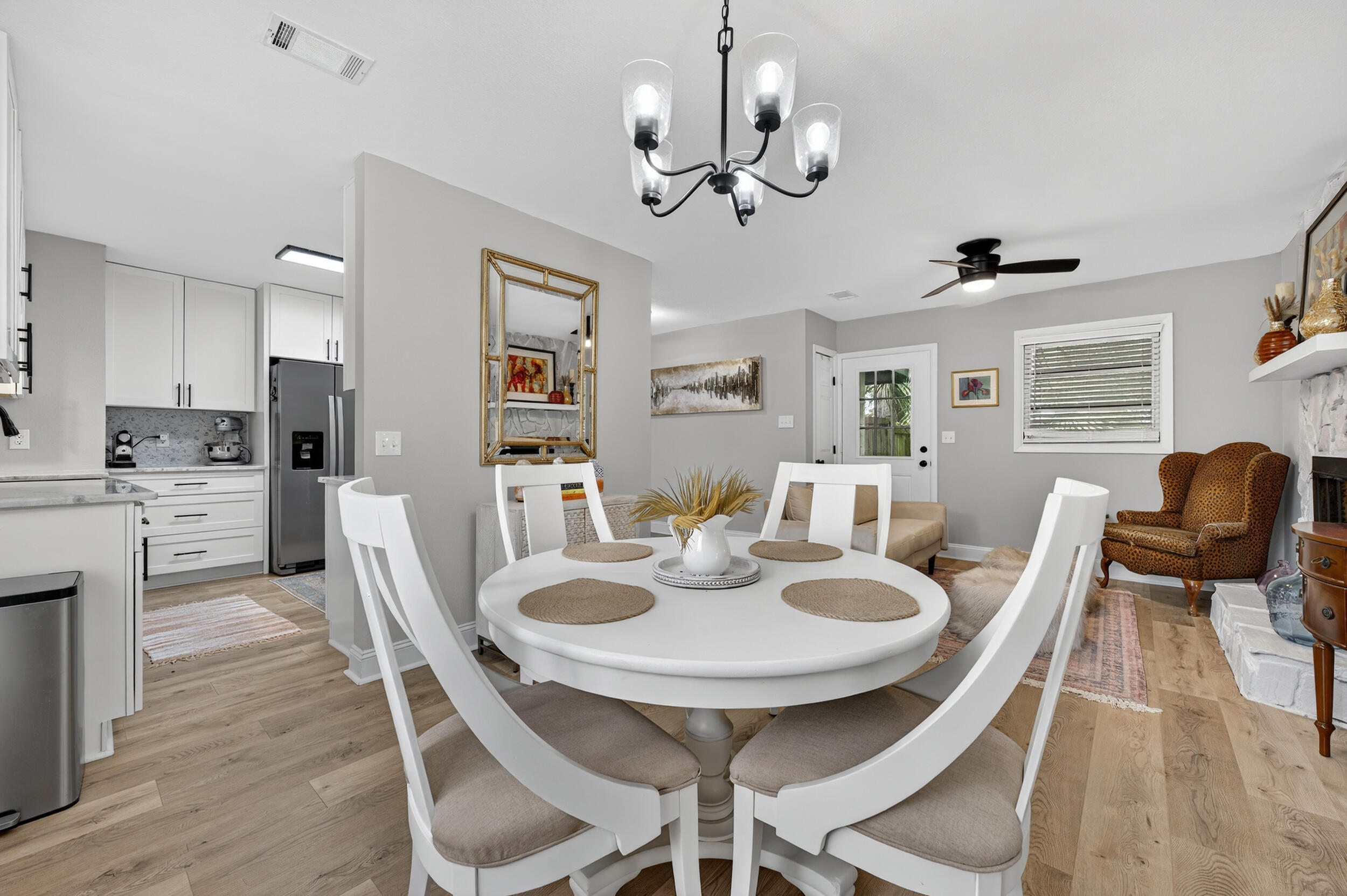 370 Edge Avenue Valparaiso, FL 32580 - Photo 24 of 58 a view of a dining room with furniture and wooden floor