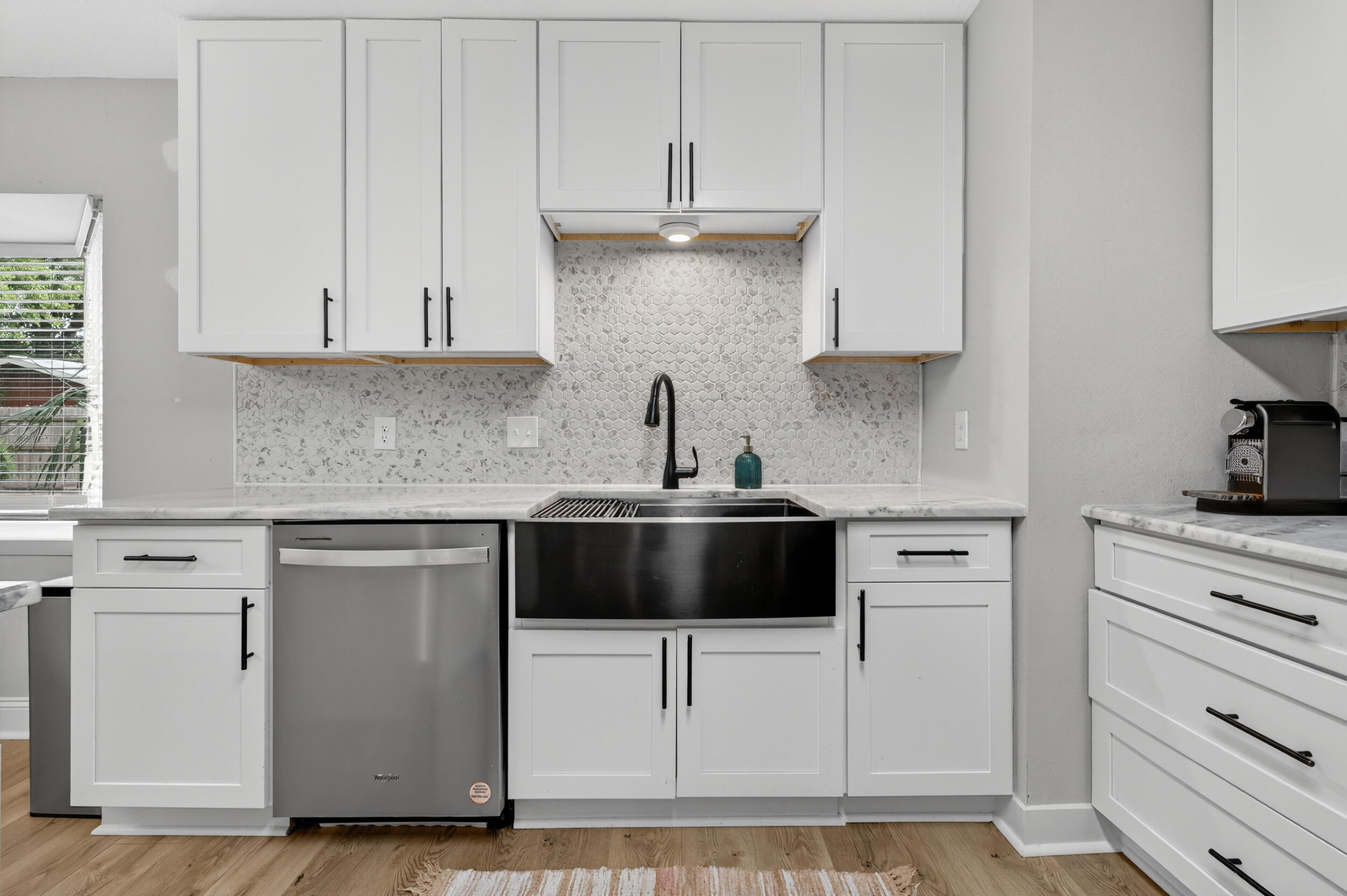 370 Edge Avenue Valparaiso, FL 32580 - Photo 25 of 58 a kitchen with granite countertop white cabinets and white appliances