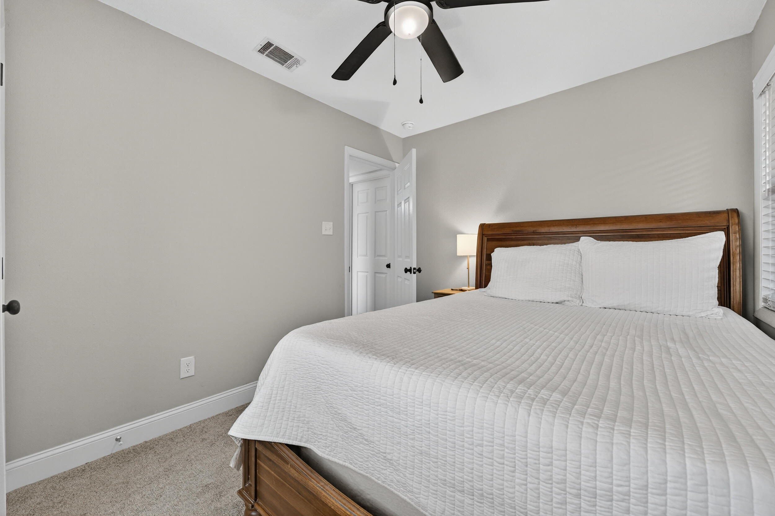 370 Edge Avenue Valparaiso, FL 32580 - Photo 37 of 58 a bedroom with a bed and a ceiling fan