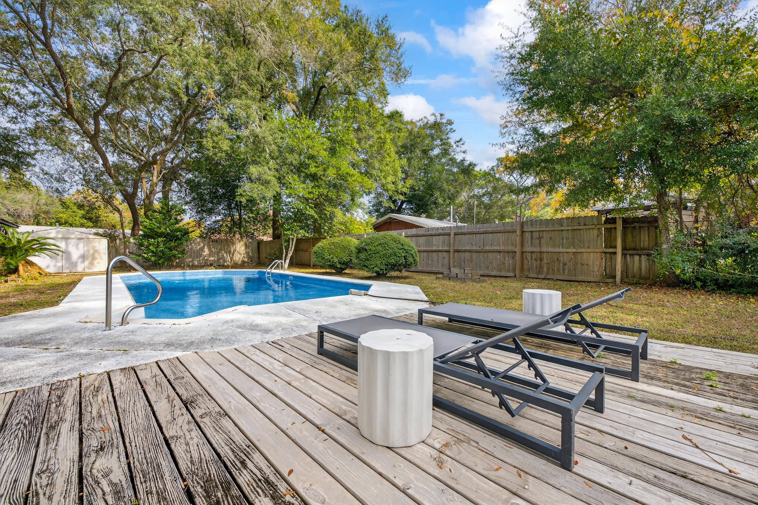 370 Edge Avenue Valparaiso, FL 32580 - Photo 44 of 58 a view of a roof deck with wooden floor and fence