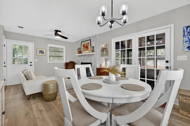a living room with fireplace furniture and a flat screen tv