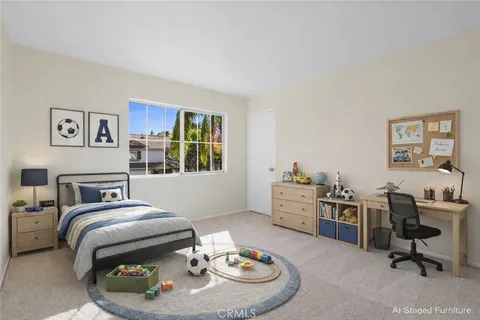 a bedroom with furniture and a wooden floor