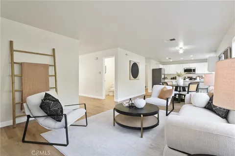 a living room with furniture and a table