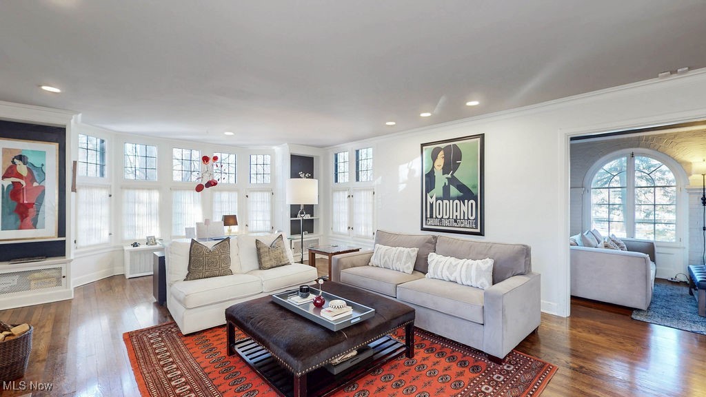Alternative angle of living room with view into sitting room.