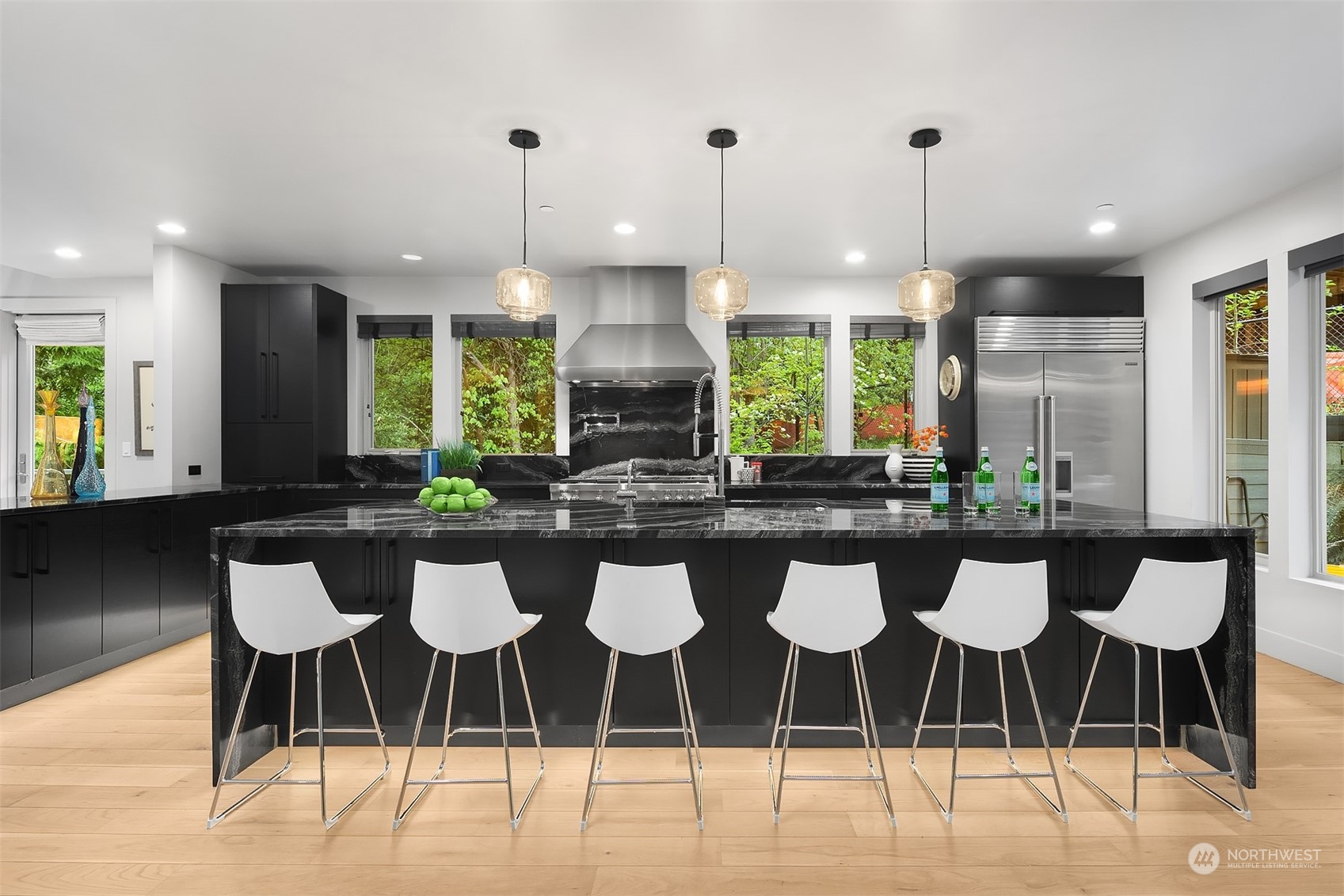 4312 West Cramer Street Seattle, WA 98199 - Photo 11 of 40 a kitchen with a table and chairs in it