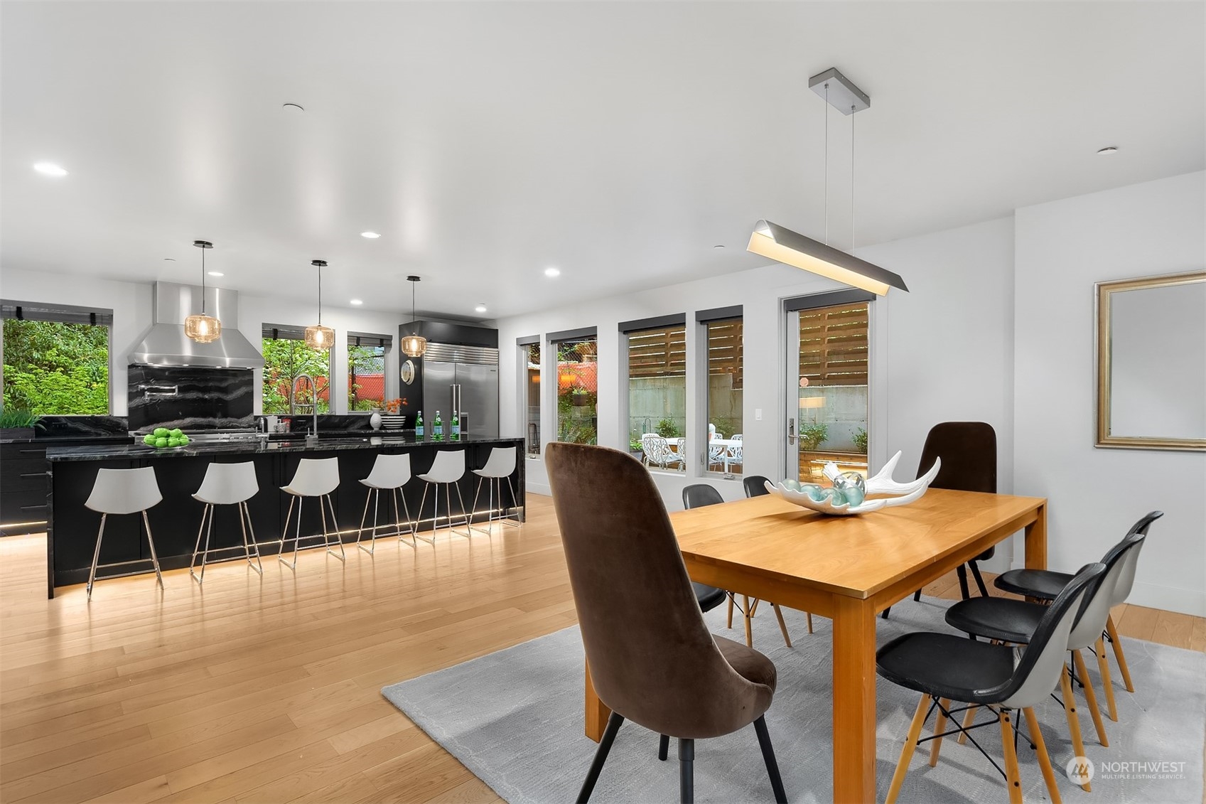 4312 West Cramer Street Seattle, WA 98199 - Photo 16 of 40 a dining room with furniture and wooden floor