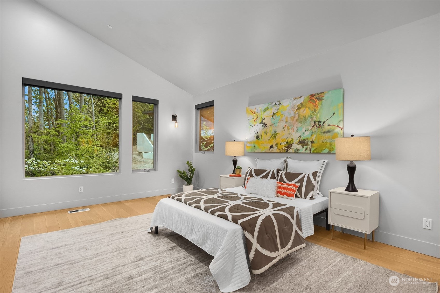 4312 West Cramer Street Seattle, WA 98199 - Photo 19 of 40 a spacious bedroom with a bed and a window