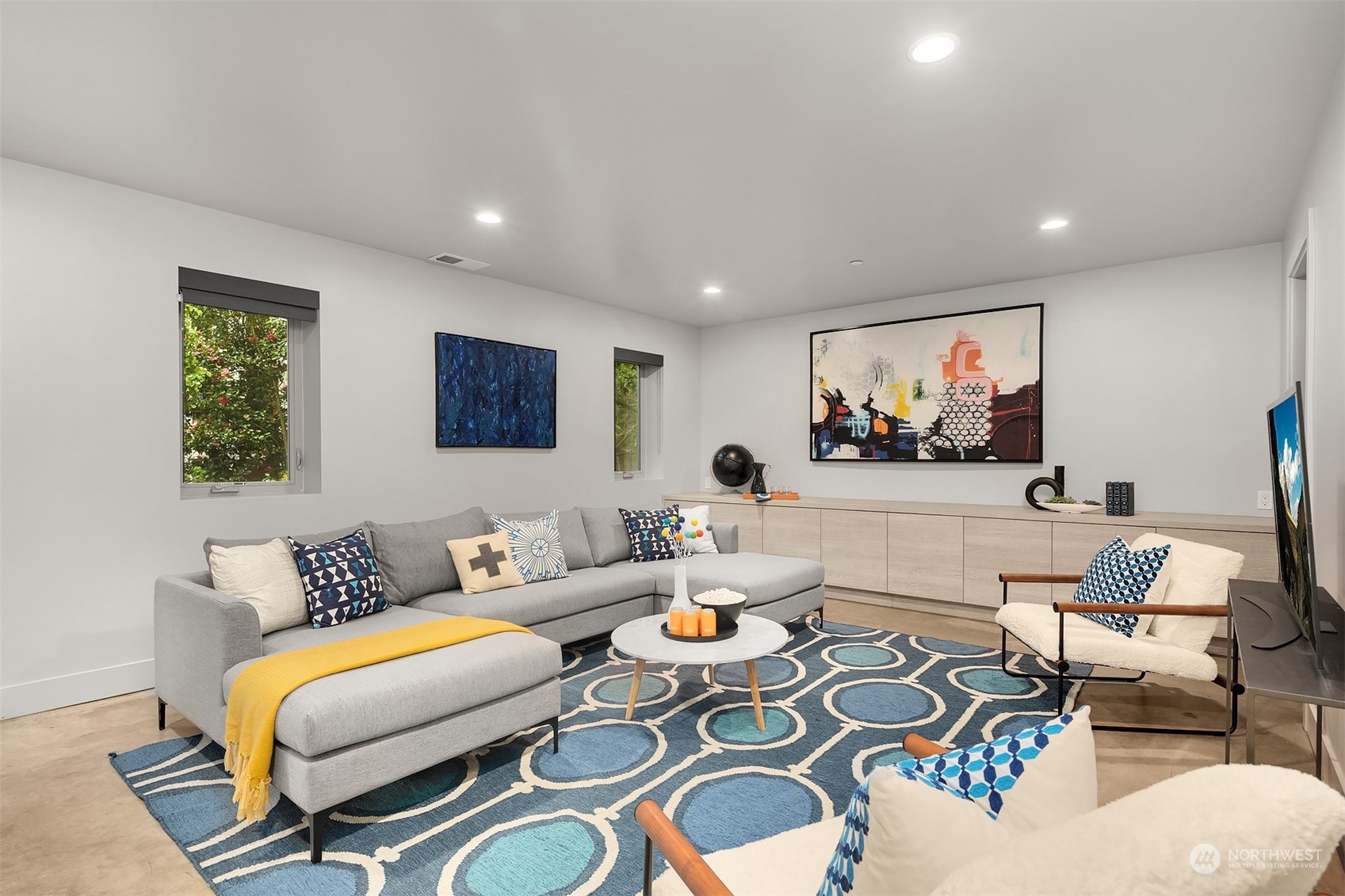 4312 West Cramer Street Seattle, WA 98199 - Photo 30 of 40 a living room with furniture and a flat screen tv