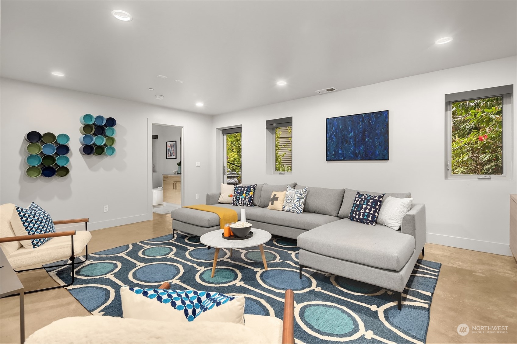 4312 West Cramer Street Seattle, WA 98199 - Photo 31 of 40 a living room with furniture and wooden floor