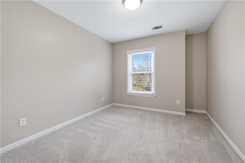 535 Ridge View Crossing Woodstock, GA 30188 - Photo 24 of 45 an empty room with windows