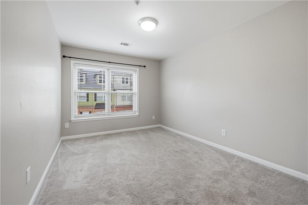 535 Ridge View Crossing Woodstock, GA 30188 - Photo 26 of 45 an empty room with windows and closet