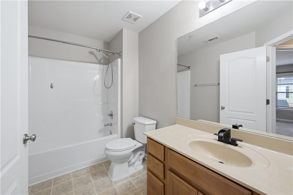 535 Ridge View Crossing Woodstock, GA 30188 - Photo 28 of 45 a bathroom with a sink toilet and shower