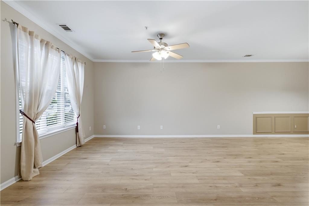 535 Ridge View Crossing Woodstock, GA 30188 - Photo 5 of 45 wooden floor in an empty room with a window