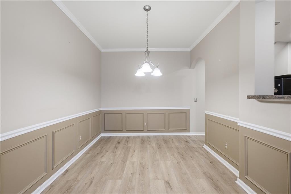 535 Ridge View Crossing Woodstock, GA 30188 - Photo 9 of 45 a view of a room with wooden floor and white walls