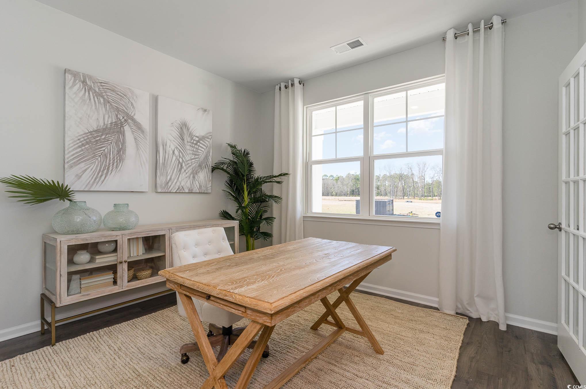 357 Acosta Circle Conway, SC 29527 - Photo 4 of 27 Dining space with wood finished floors and baseboards
