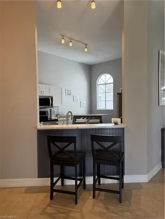 a kitchen with a table and chairs in it
