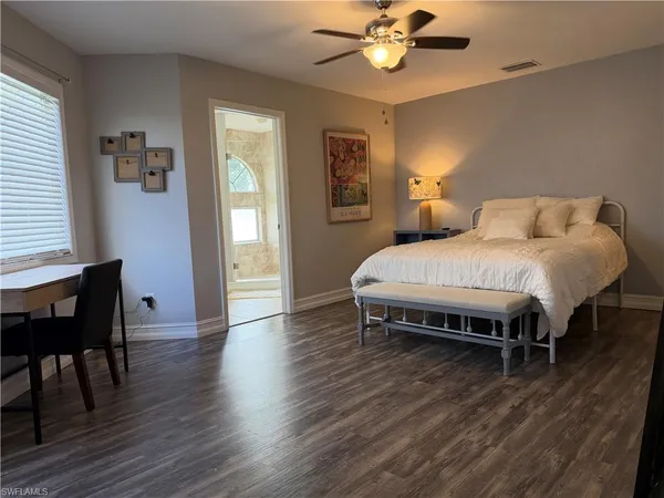 a bedroom with a bed and a table in it