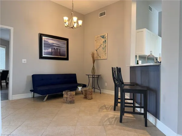 a room that has a chair and a chair in it