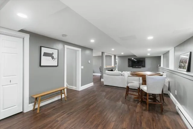 a living room with dining room and wooden floor