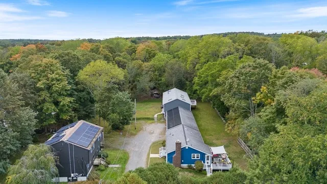 a aerial view of a house with a yard