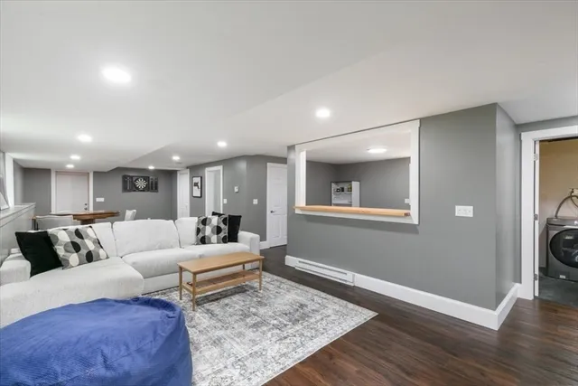 a living room with furniture and a rug