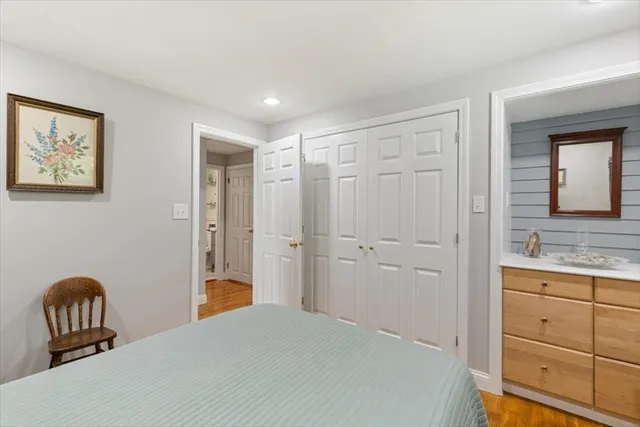 a bedroom with a bed and a dresser