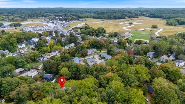 an aerial view of a houses with a lake and lake view