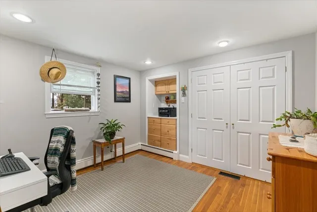 a view of a livingroom with furniture and wooden floor