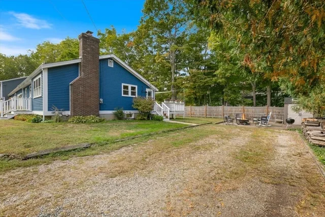 a view of backyard with large trees