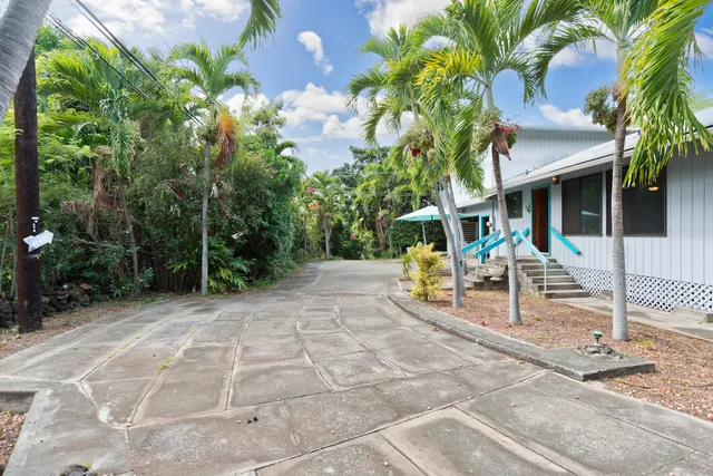 a view of patio with table and chairs and potted plants
