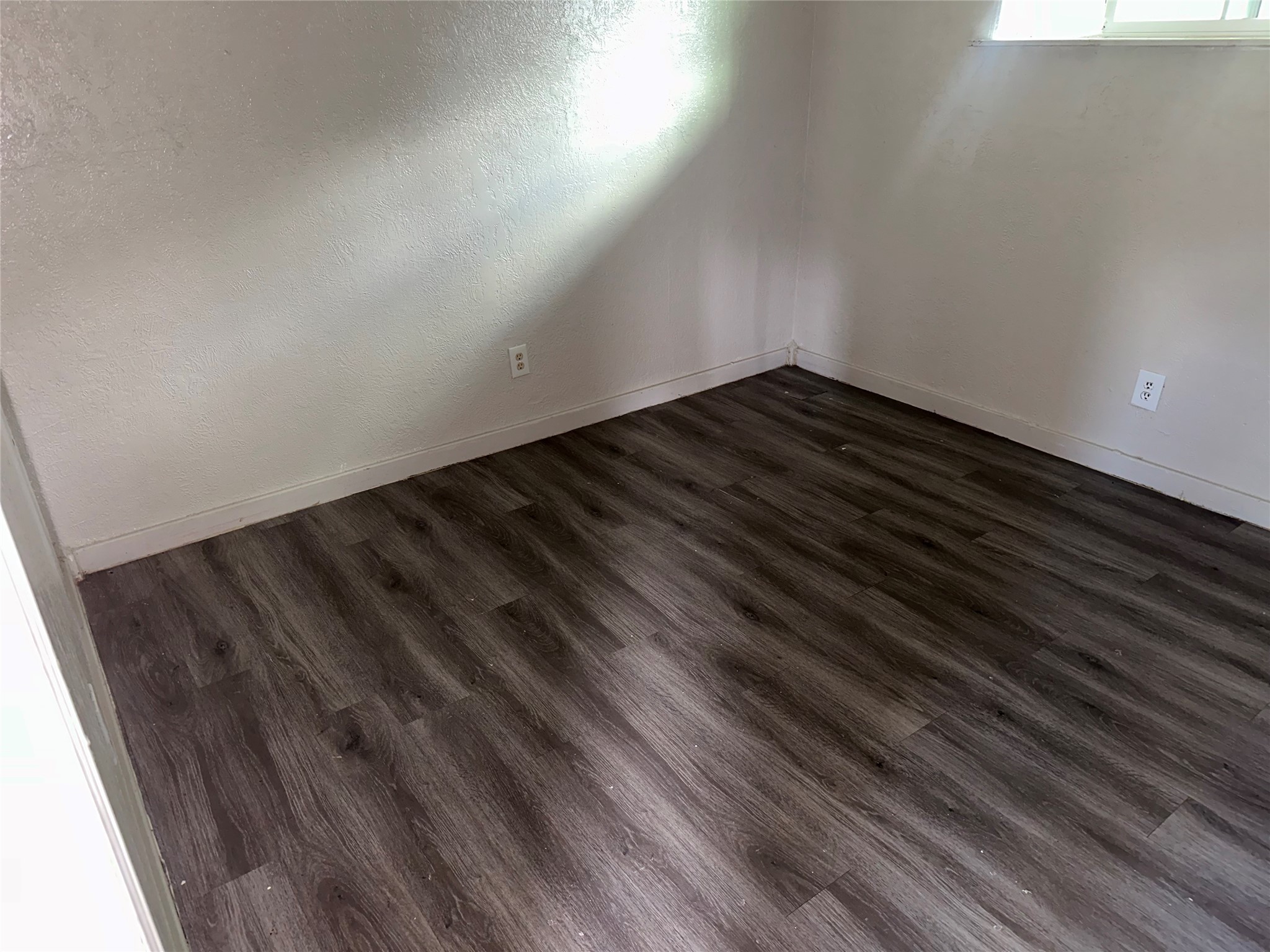 5405 Suez Street, Unit 4 Houston, TX 77020 - Photo 5 of 10 a view of room with wooden floor
