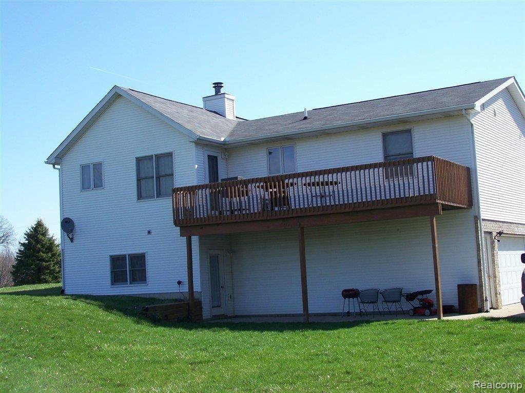 2229 Fowlerville Road Fowlerville, MI 48836 - Photo 12 of 12 BACK VIEW OF HOUSE AND DECK