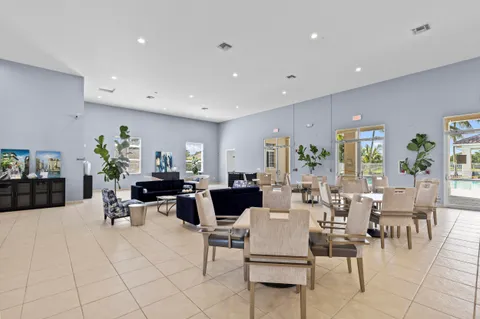 an aerial view of a house with a yard basket ball court and outdoor seating