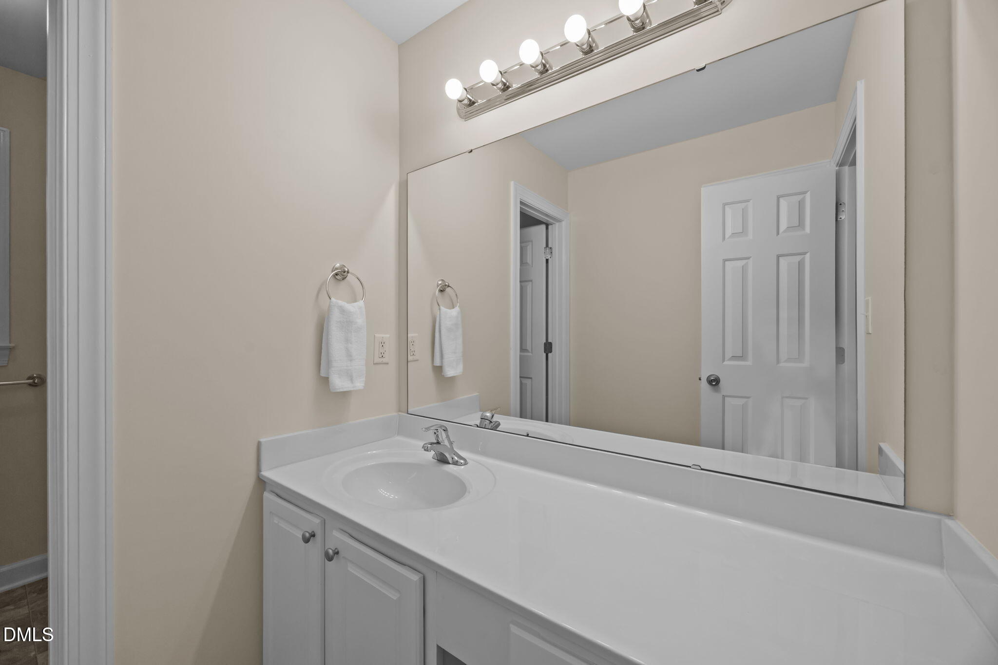505 Vinson Road Clayton, NC 27527 - Photo 24 of 31 a bathroom with a sink vanity and a mirror