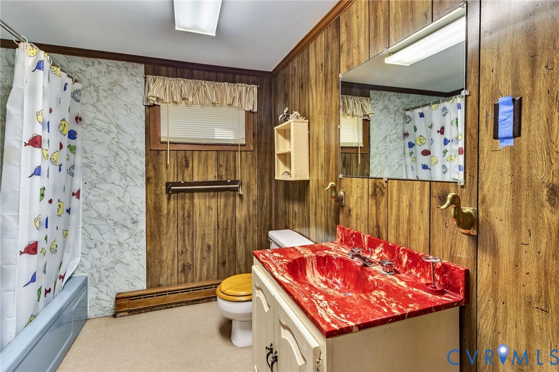 142 Bridge Lane Reedville, VA 22539 - Photo 16 of 56 a bathroom with a shower curtain and a sink