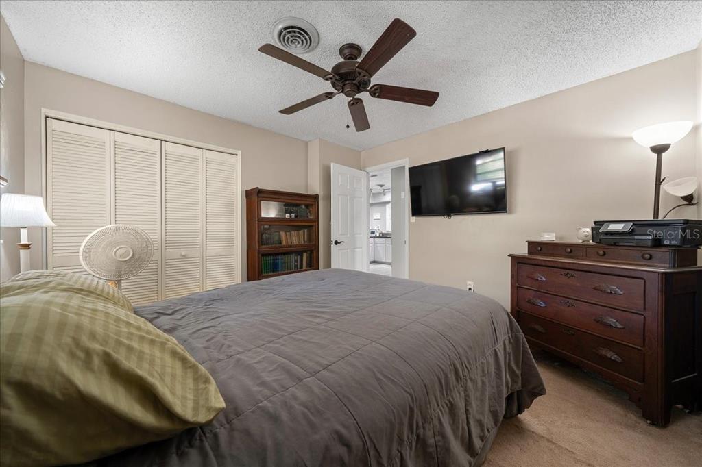 430 Southwest 43rd Place Ocala, FL 34471 - Photo 24 of 83 a bedroom with a bed and a flat screen tv