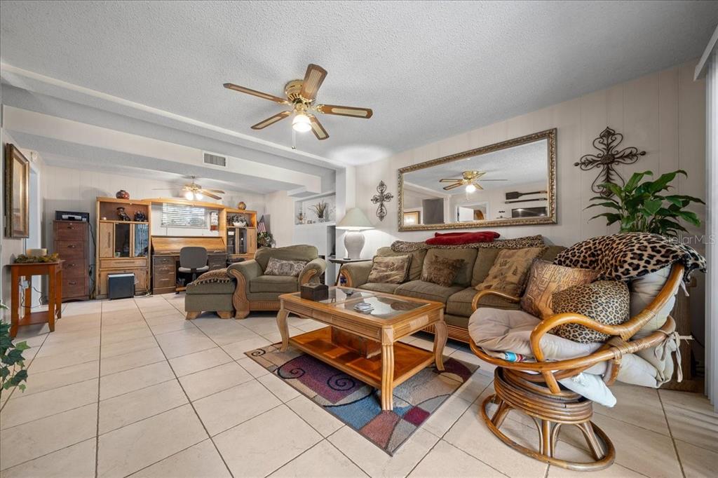 430 Southwest 43rd Place Ocala, FL 34471 - Photo 31 of 83 a living room with lots of furniture and a chandelier